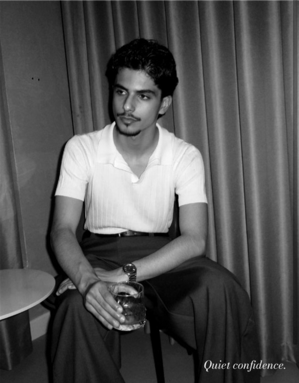 Malek seated